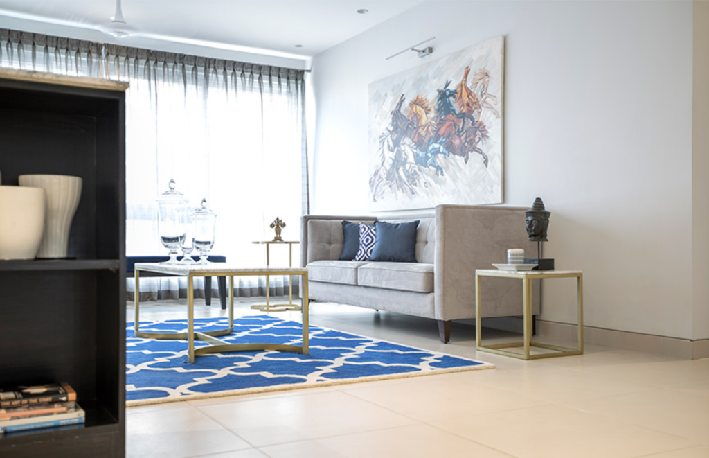 Grey sofa and Blue Rug designs for living room